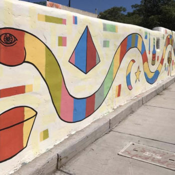 Abstract mural of a snake created from shapes.