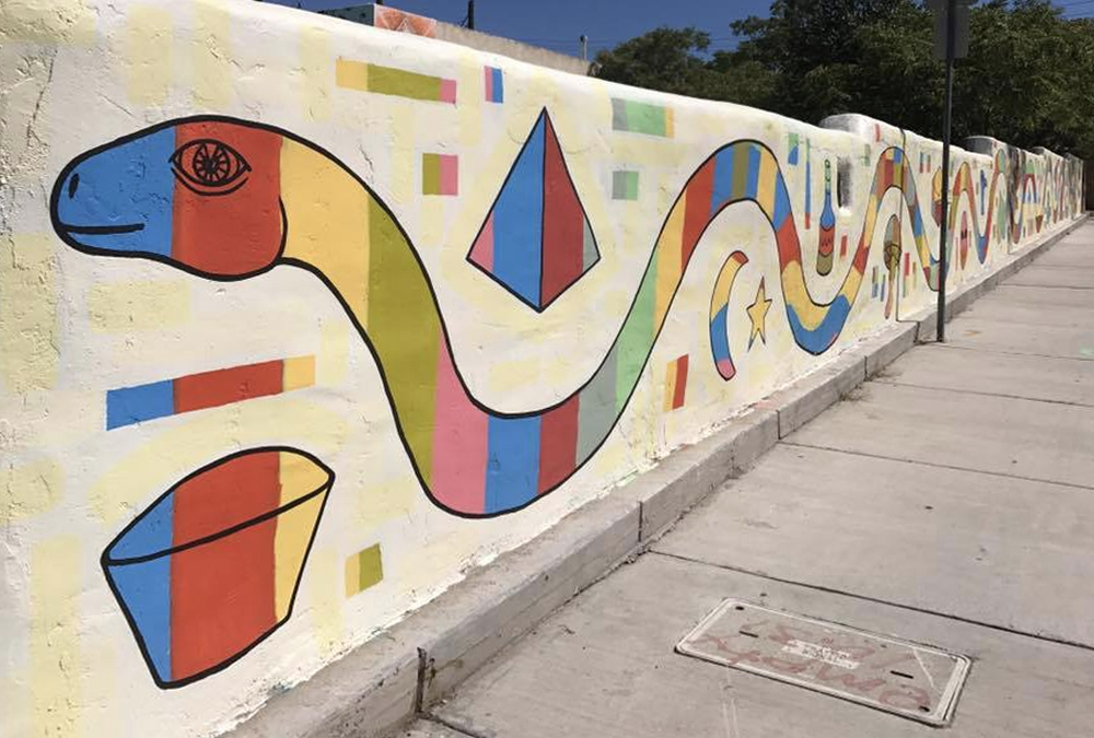 Abstract mural of a snake created from shapes.