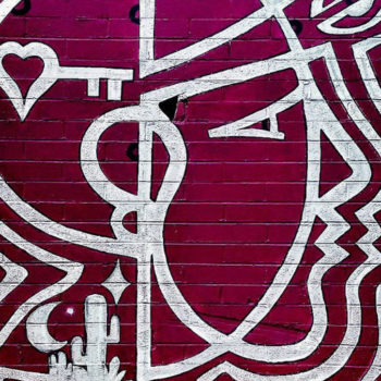 Simple line mural of a woman's head with a heart in it in only two colors. like a rose