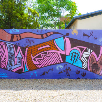 Tribal snake mural with bits of aztec symbolism
