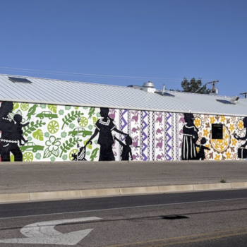 mural of shadow figures on colorful wall paper