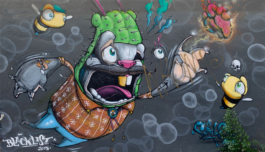 cartoon animal in cactus costume mural