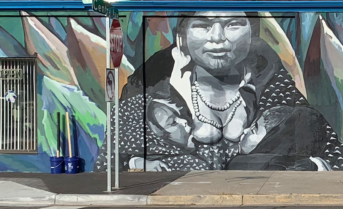 black and white mural of woman breastfeeding
