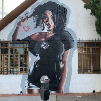 mural on house of sassy lady twirling hair