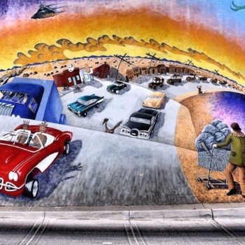 painting of cars on highway in desert