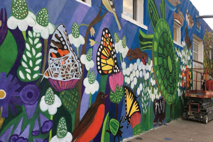 scene of flora and fauna mural on wall