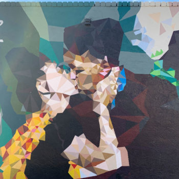 mural of two pixelated figureskissing