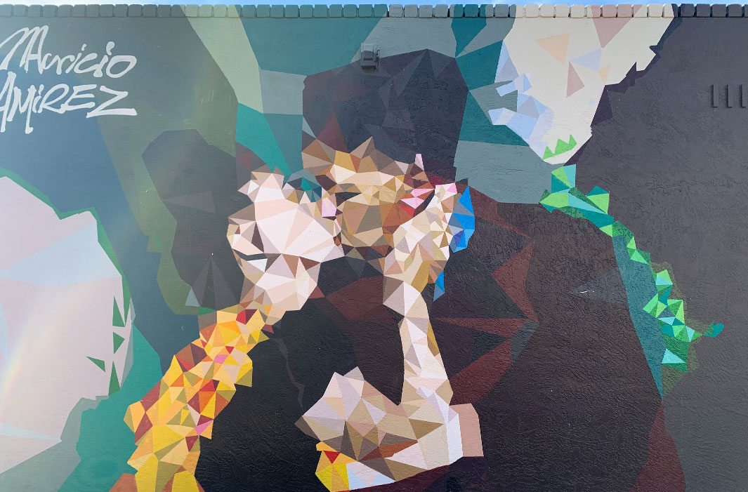 mural of two pixelated figureskissing