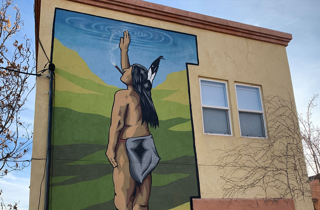 mural of smoking Indian salute
