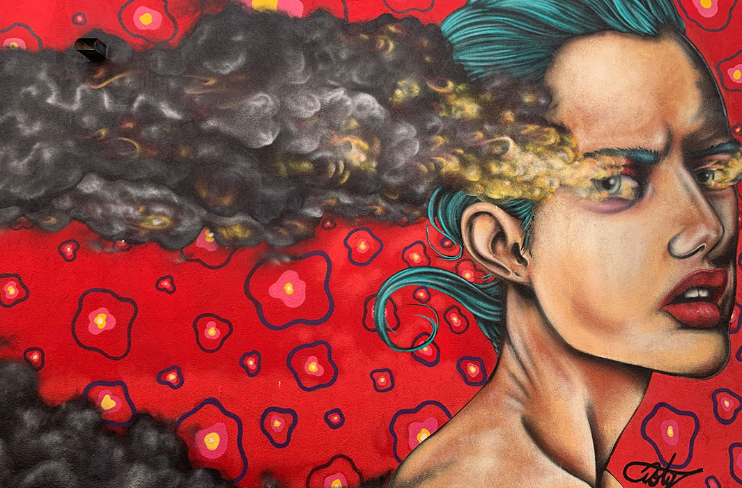 mural of woman with smoking eyes
