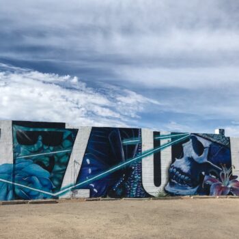 Large white letters spelling AZUL amidst blue imagery